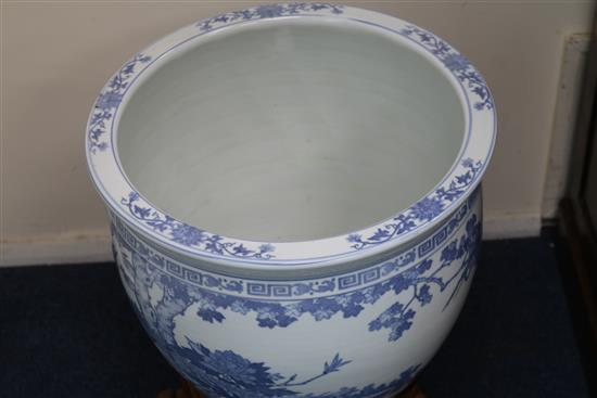 Two Chinese blue and white fish bowls on stands